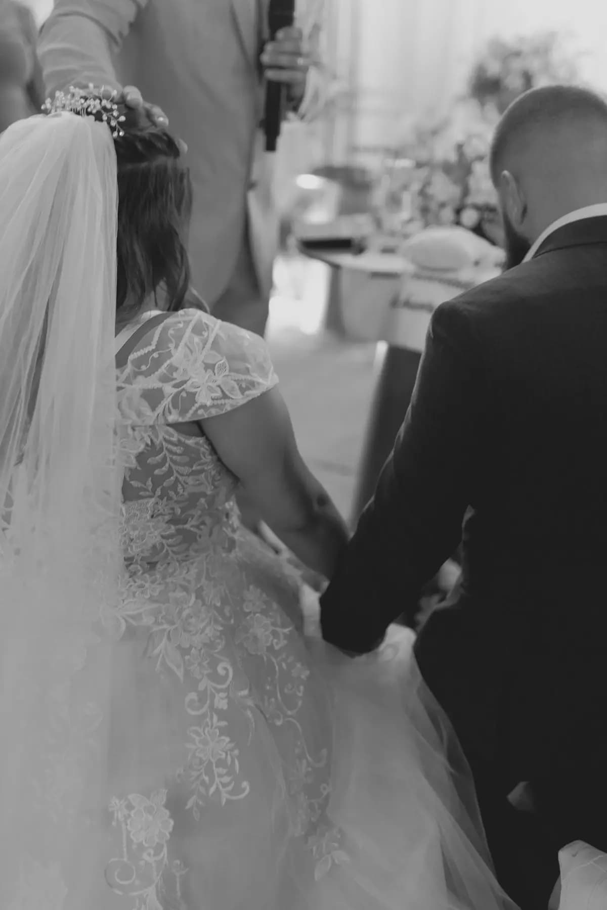 Couple holding hands during their ceremony